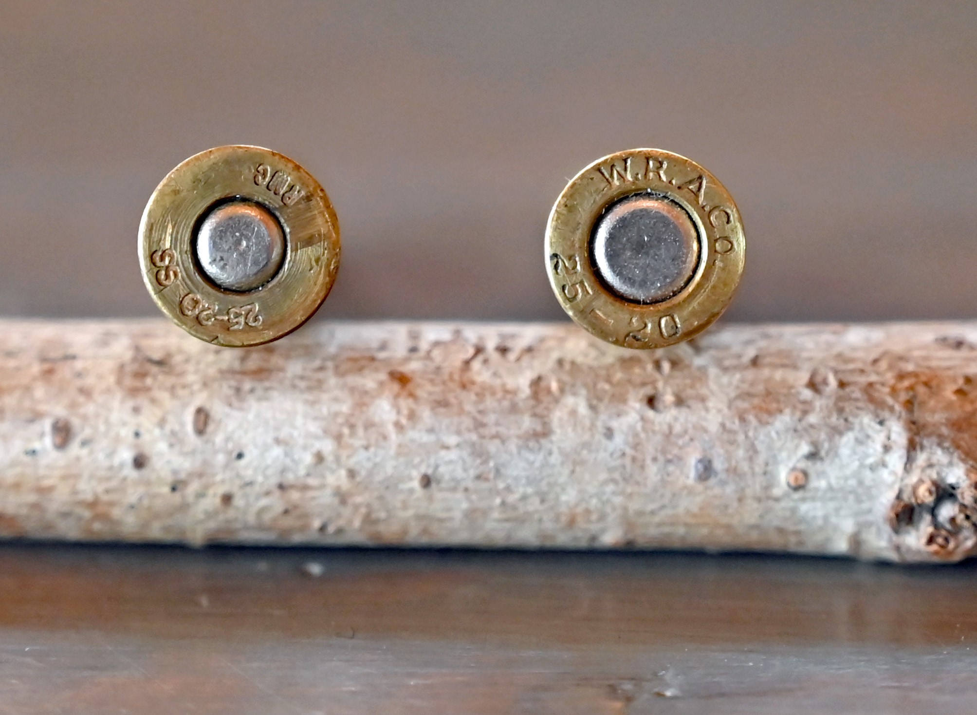 Modern Rocky Mountain Cartridge 25-20 Single Shot case on left, showing the Small Rifle primer and a vintage WRA 25-20 Single Shot cartridge with Large Rifle primer.